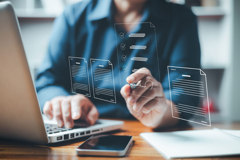 Businesswoman using digital device signs electronic documents online. Paperless workplace idea e signing electronic signature Technology and document management. future business contract signing | ANG