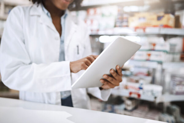 Pharma-Pharmacist,-tablet-and-woman-for-healthcare,-medicine-and-digital-vaccine-prescription-in-health-store.-Employee,-technology-and-online-pharmacy-for-medical-service Pharma-Pharmacist,-tablet-and-woman-for-healthcare,-medicine-and-digital-vaccine-prescription-in-health-store.-Employee,-technology-and-online-pharmacy-for-medical-service