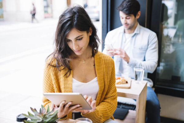 female-cafe-working-tablet