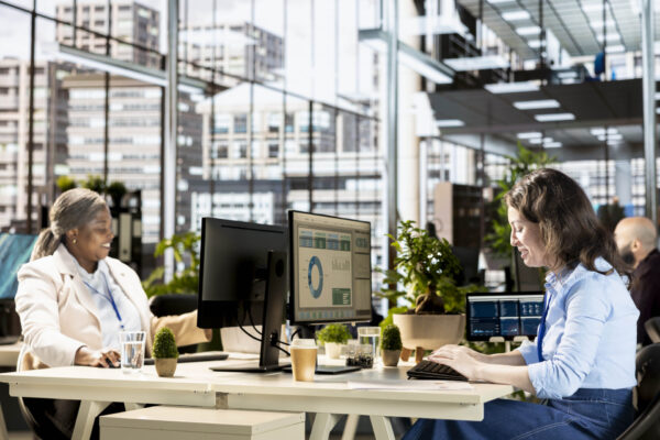 Female manager engaged in budget analysis and strategy development at the office, achieving objectives for enterprise growth. Woman managing analytics to accomplish business goals.